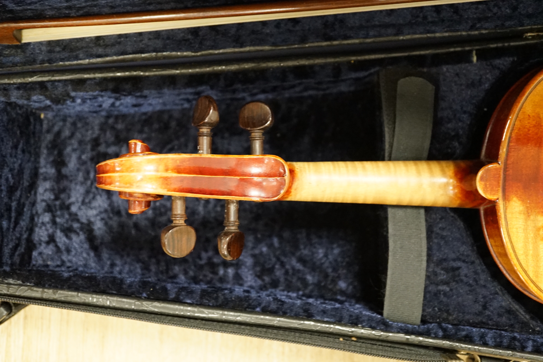 A cased fine French half size violin, Mirecourt, length of body 31.5cm with a bow and case, CITES Submission reference SLU5G6CY